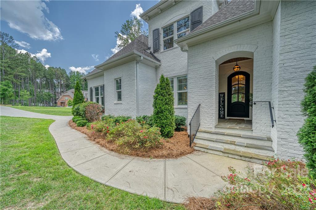 4026 Country Overlook Drive Fort Mill, SC 29715 - Photo 5 of 43 a front view of a house with garden