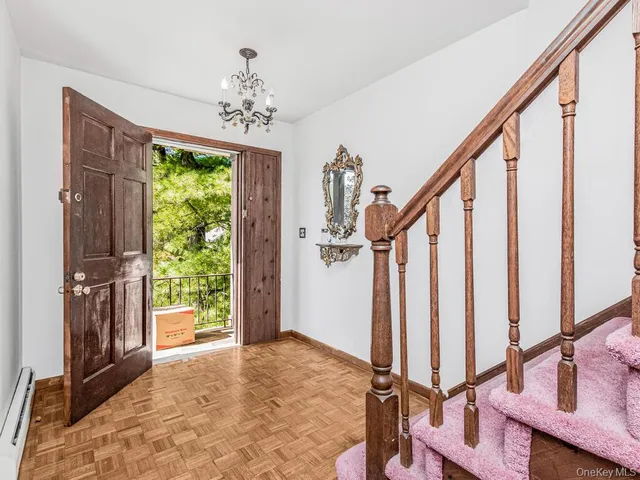 a view of an entryway with hardwood floor and interior