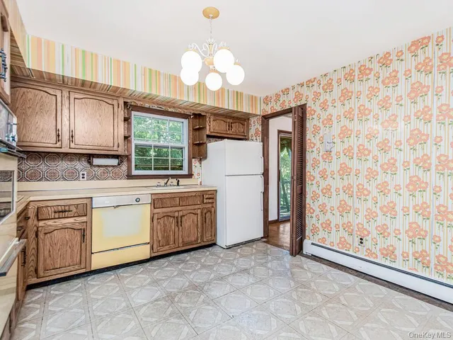 a kitchen with granite countertop cabinets and window