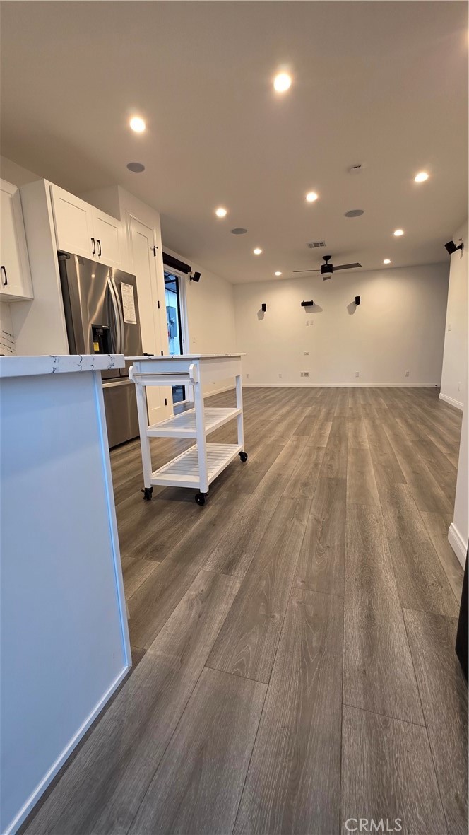 18222 Chatsworth Street Porter Ranch, CA 91326 - Photo 21 of 41 a living room with furniture and a wooden floor