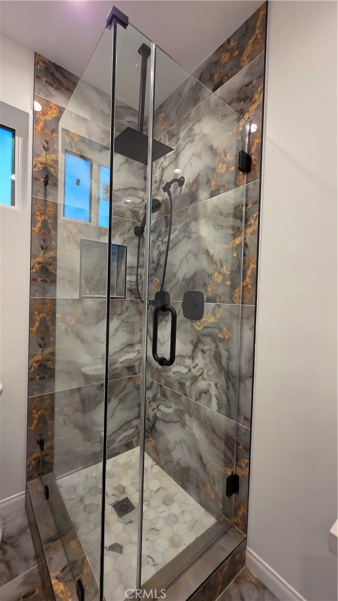 18222 Chatsworth Street Porter Ranch, CA 91326 - Photo 25 of 41 a bathroom with a shower