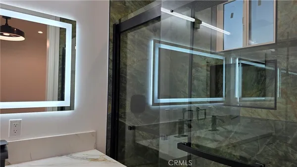 a bathroom with a sink and mirror