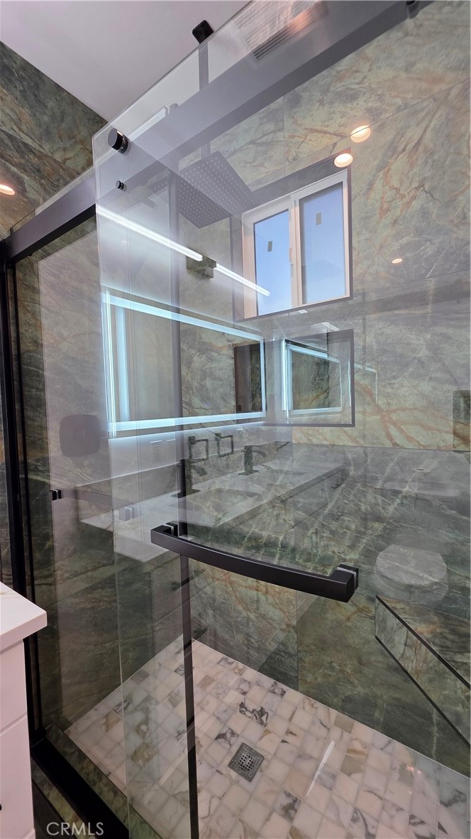 18222 Chatsworth Street Porter Ranch, CA 91326 - Photo 32 of 41 a bathroom with a sink and a mirror