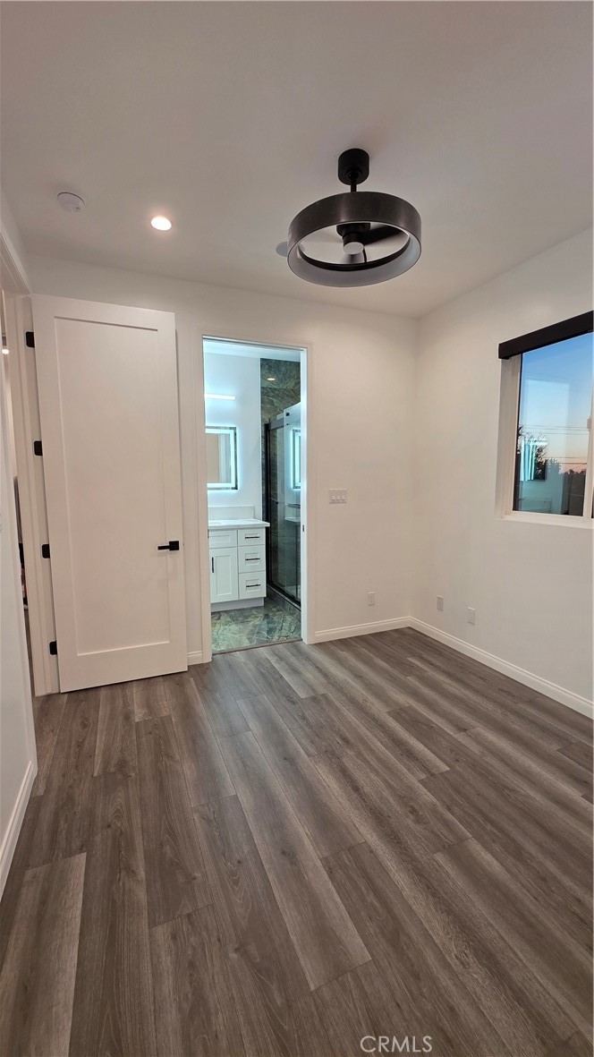 18222 Chatsworth Street Porter Ranch, CA 91326 - Photo 35 of 41 a view of an empty room and wooden floor