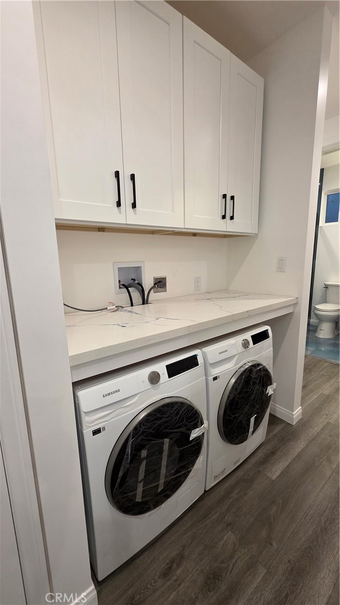 18222 Chatsworth Street Porter Ranch, CA 91326 - Photo 38 of 41 a utility room with dryer and washer