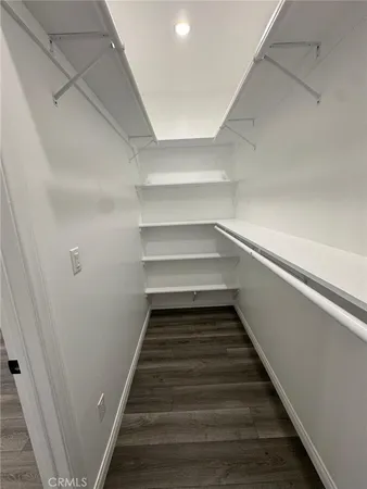 a storage room with wooden floor