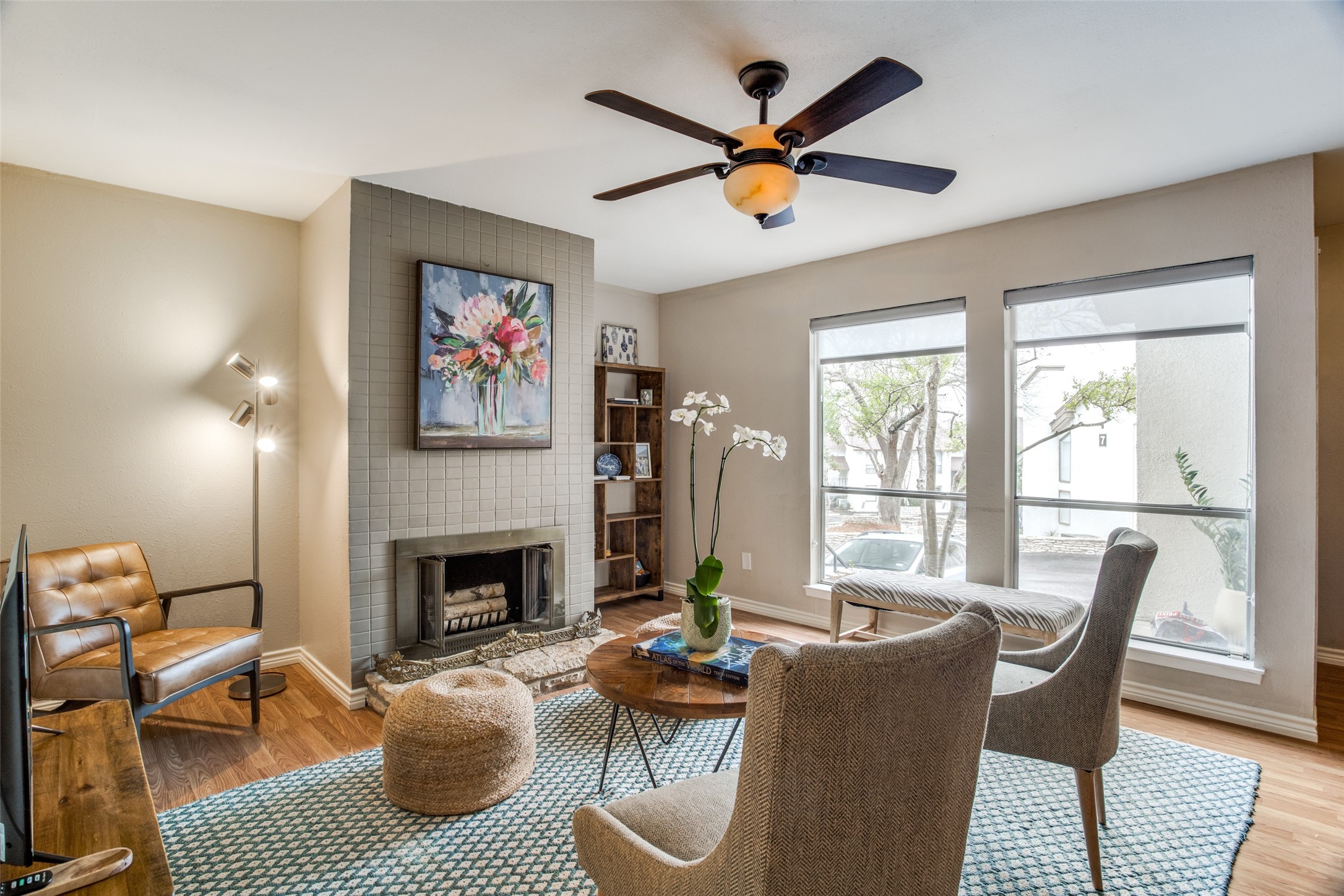 6910 Hart Lane, Unit 507 Austin, TX 78731 - Photo 1 of 1 Living area with lots of natural light and wood burning fireplace