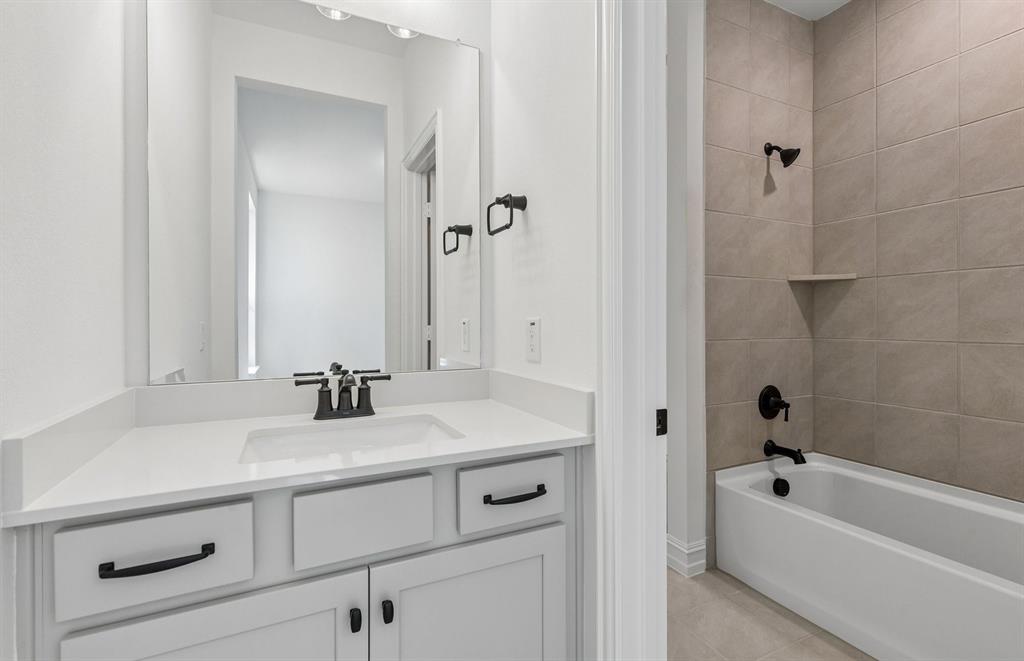 1837 Naseby Road Fort Worth, TX 76052 - Photo 21 of 28 Secondary bath with tile surrounded shower
