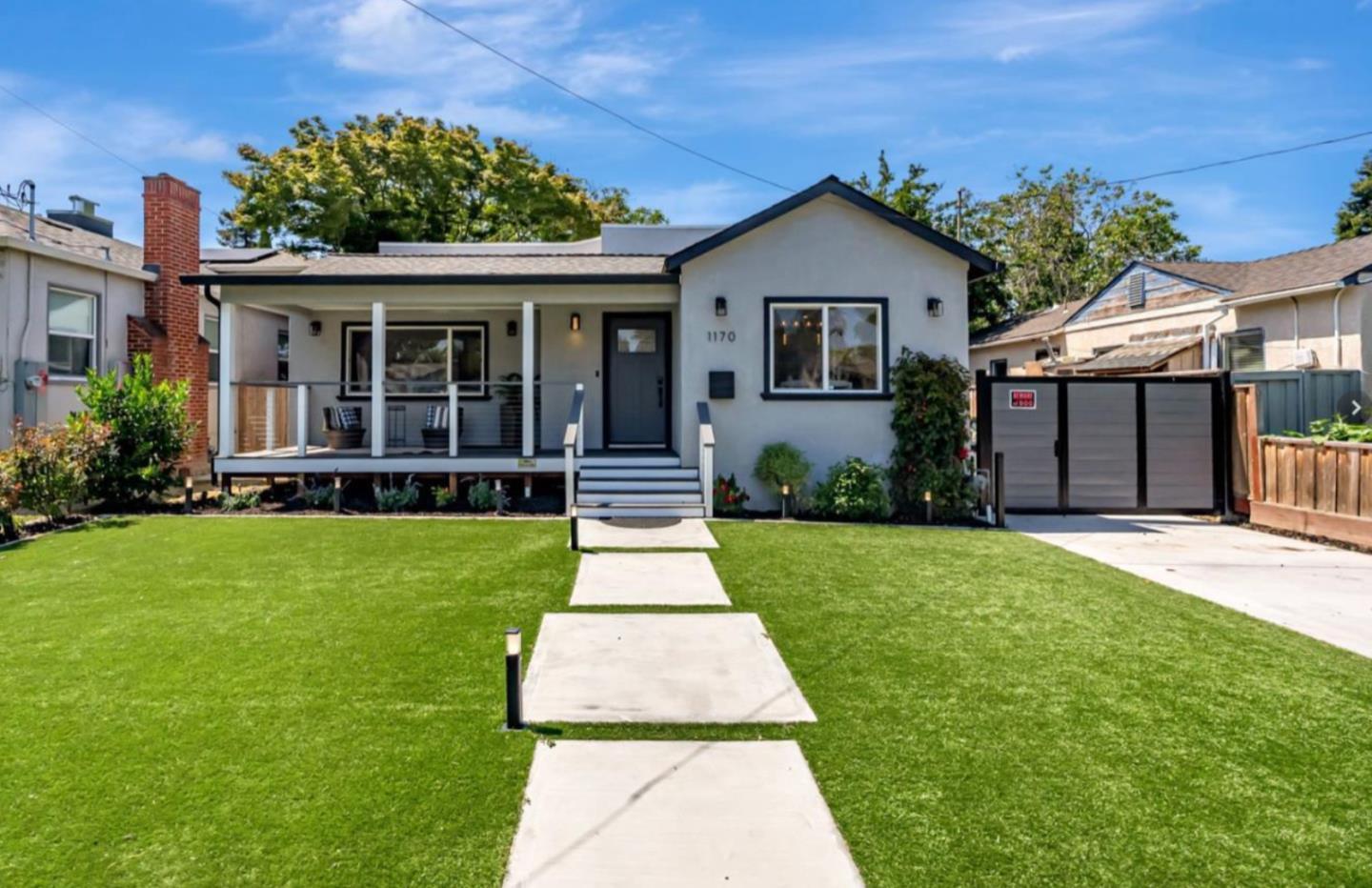 a front view of a house with a yard and porch