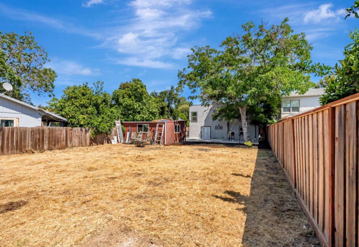 1170 Cotter Way Hayward, CA 94541 - Photo 15 of 18 a backyard of a house with table and chairs plants and large tree