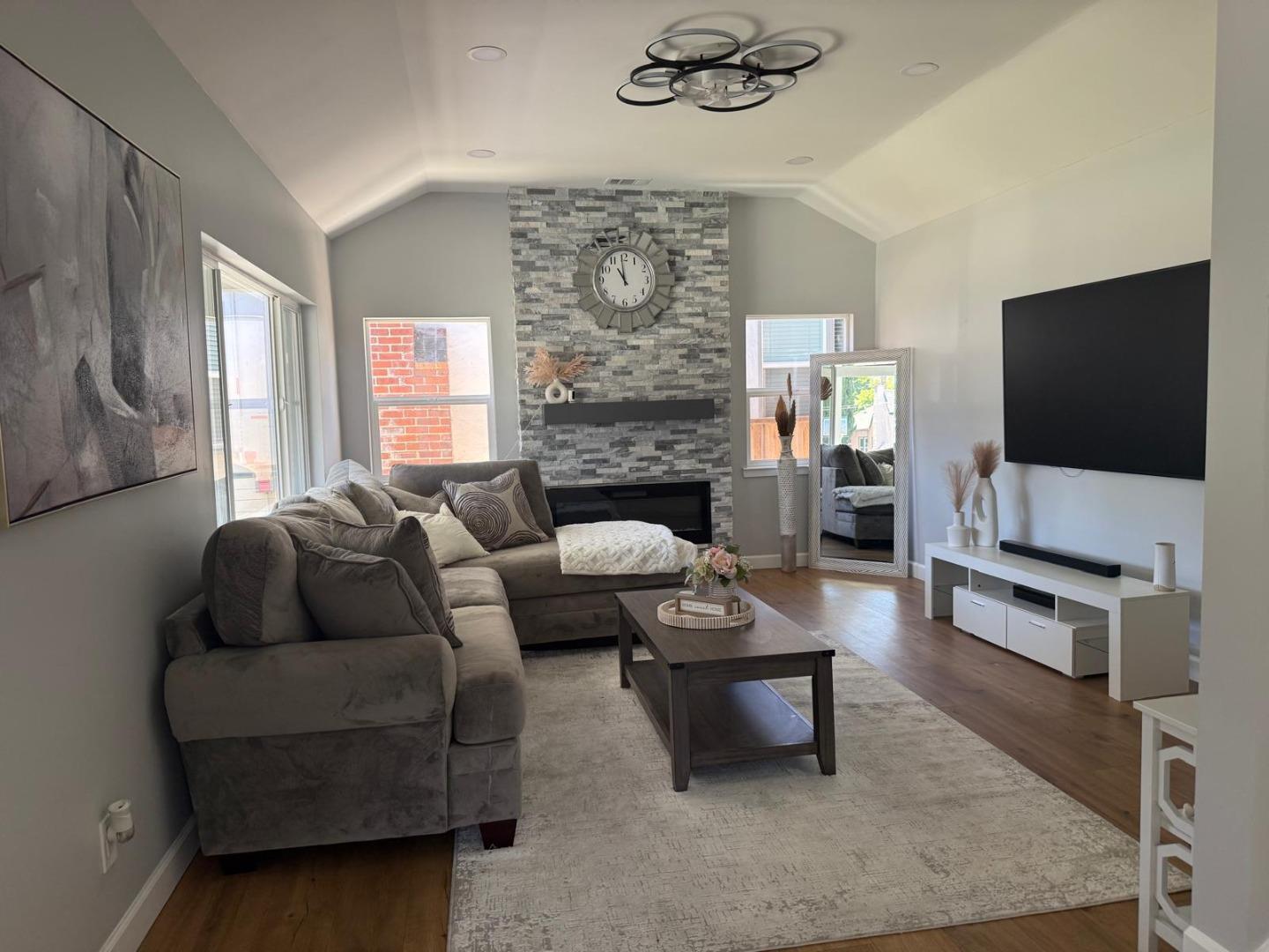 1170 Cotter Way Hayward, CA 94541 - Photo 6 of 18 a living room with fireplace furniture and a flat screen tv