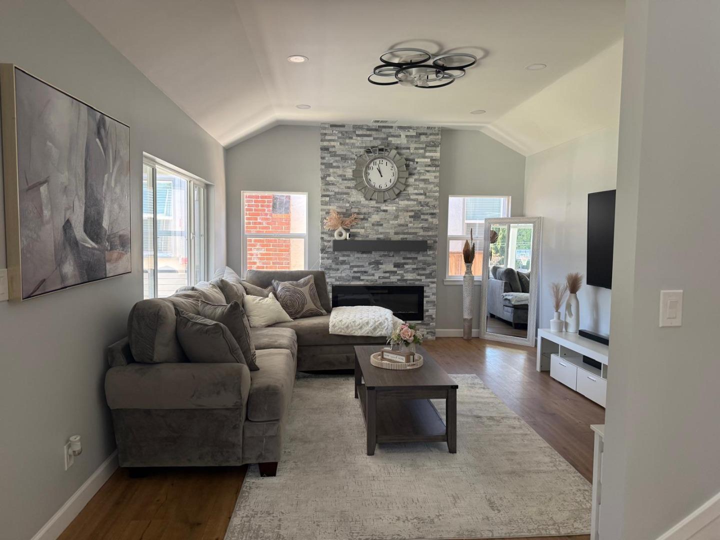 1170 Cotter Way Hayward, CA 94541 - Photo 7 of 18 a living room with furniture and a fireplace