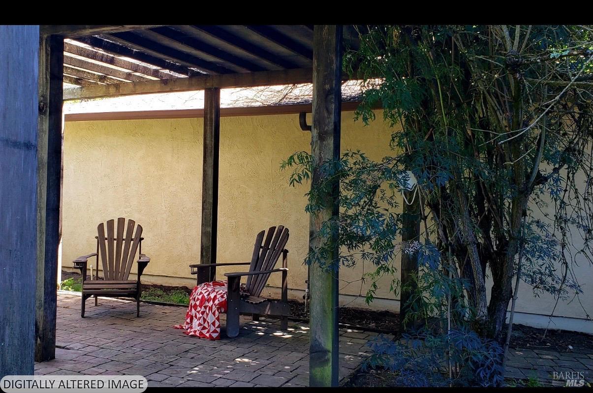 1927 Marsh Road Santa Rosa, CA 95403 - Photo 21 of 31 a patio with table and chairs and potted plants