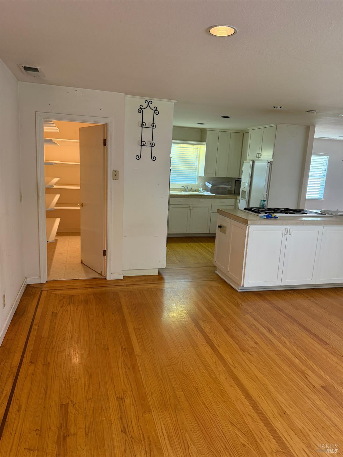 1927 Marsh Road Santa Rosa, CA 95403 - Photo 9 of 31 a view of open kitchen with wooden floor and electronic appliances
