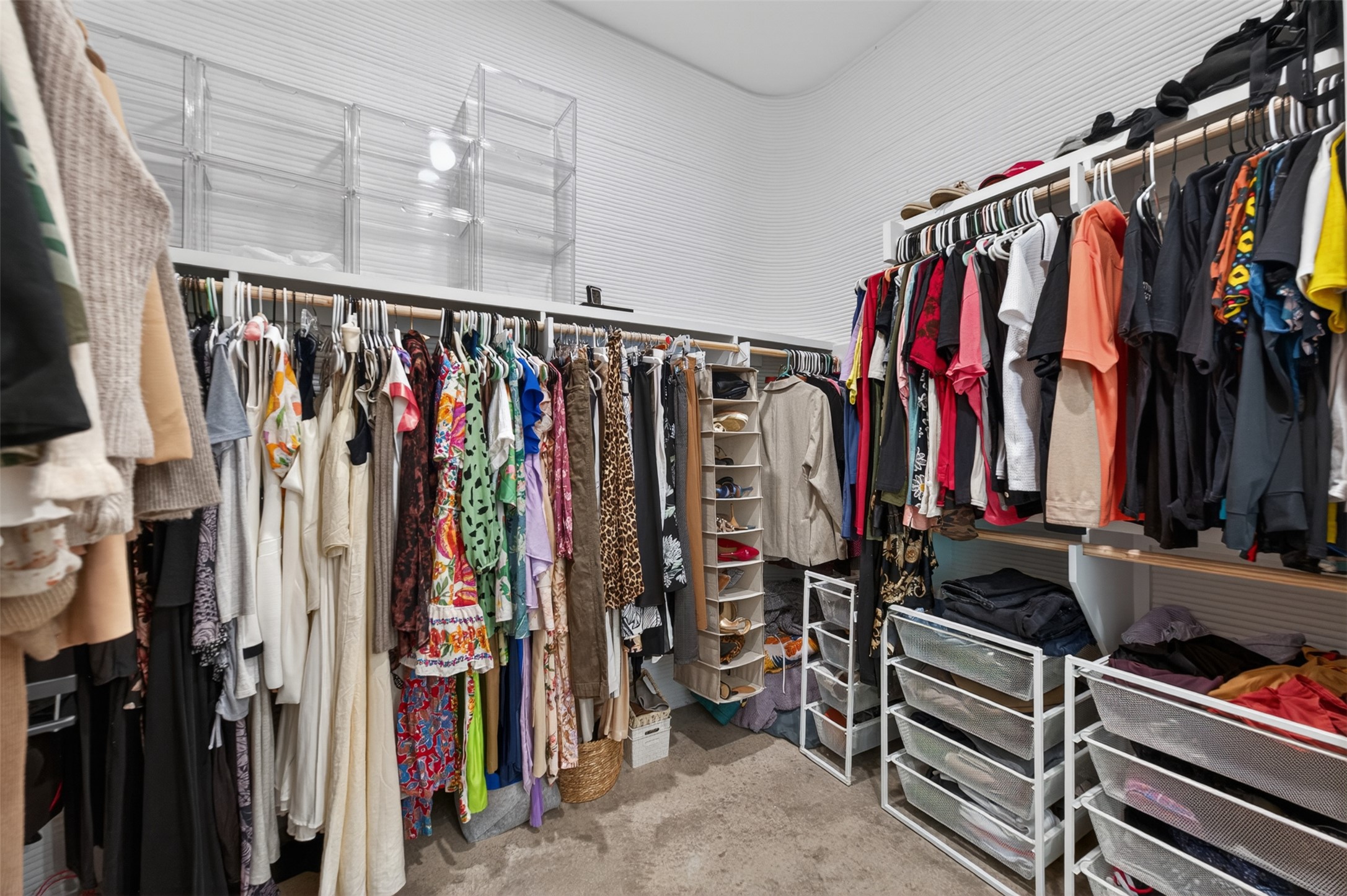 308 Painted Sunset Drive Georgetown, TX 78628 - Photo 26 of 26 Expansive closet featuring multiple clothing rods, integrated shelving, open wire shelving units, and built-in drawer storage