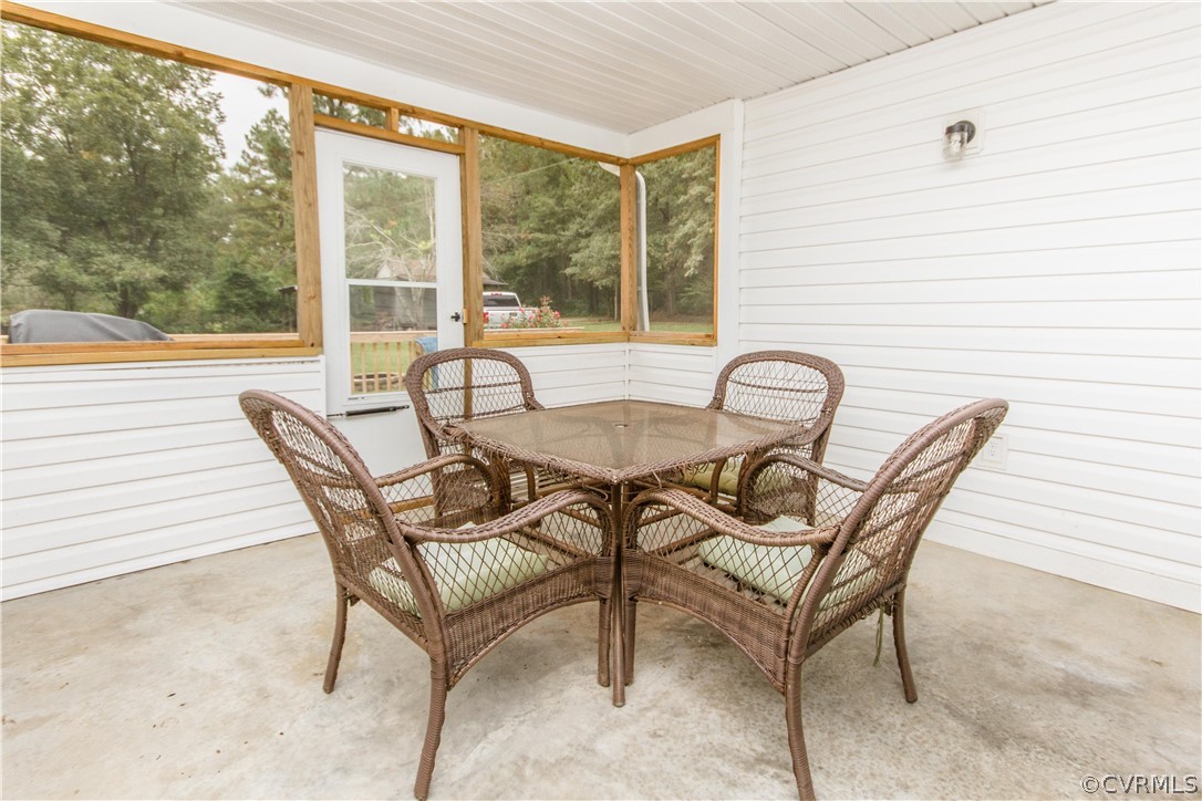 13404 Scotts Road Dewitt, VA 23840 - Photo 14 of 31 a view of a dining room with furniture and wooden floor