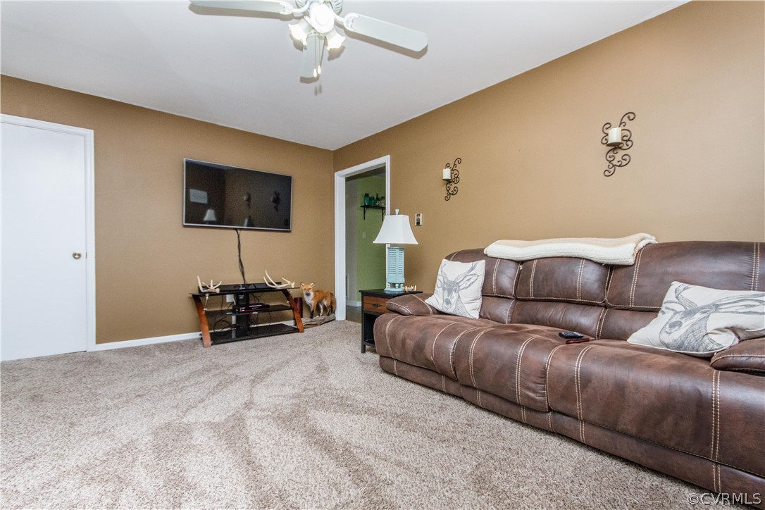 13404 Scotts Road Dewitt, VA 23840 - Photo 23 of 31 a living room with furniture and a flat screen tv