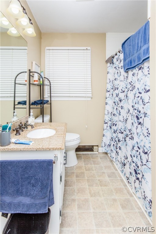 13404 Scotts Road Dewitt, VA 23840 - Photo 27 of 31 a bathroom with a sink a toilet and a mirror