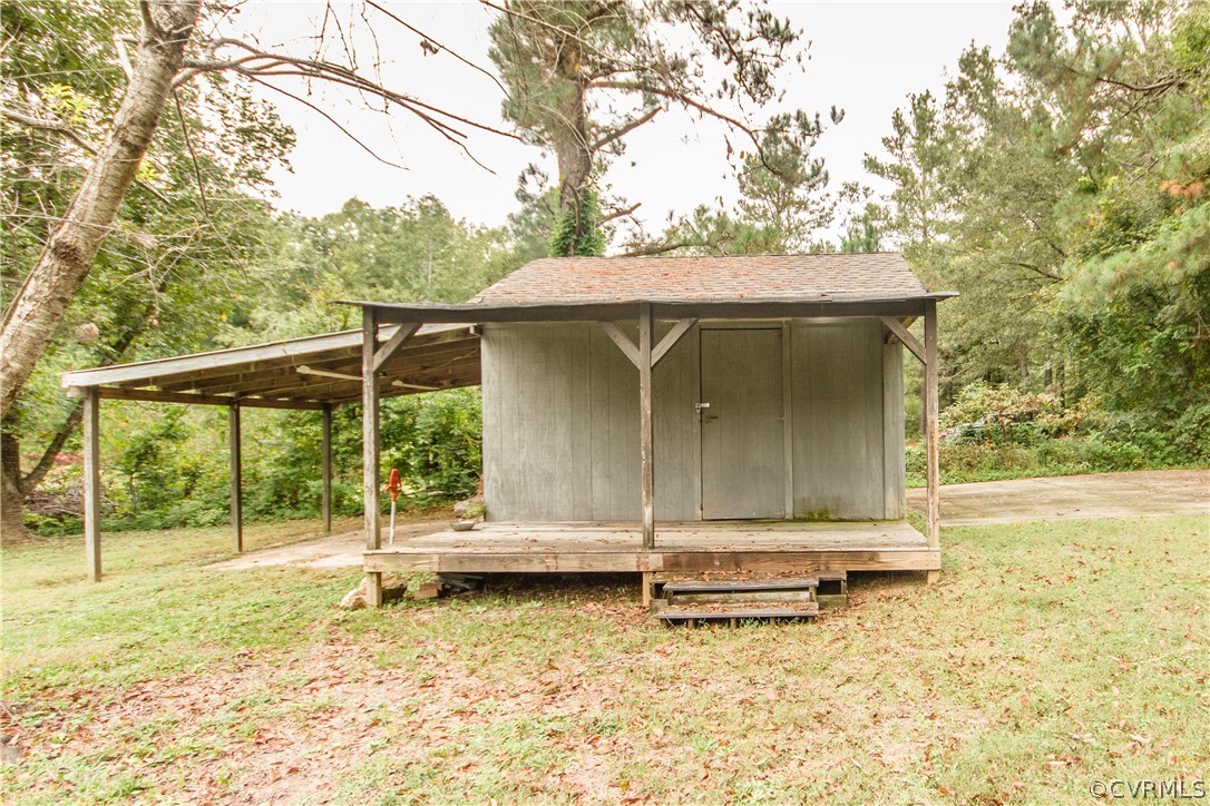 13404 Scotts Road Dewitt, VA 23840 - Photo 6 of 31 a backyard of a house with barbeque oven table and chairs