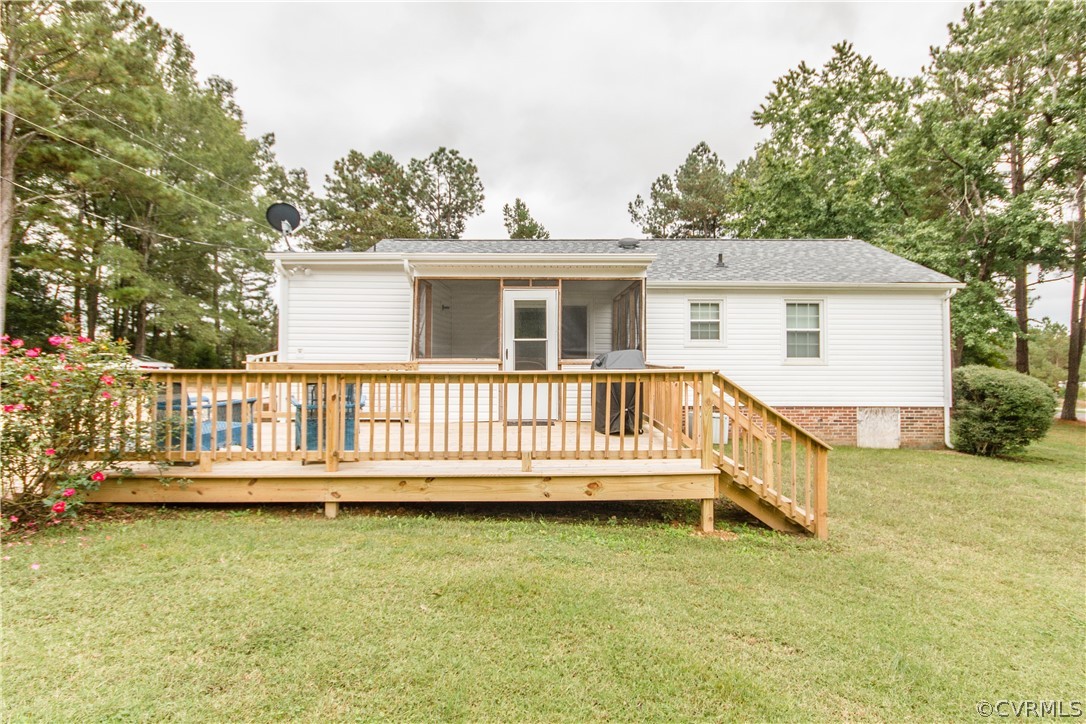 13404 Scotts Road Dewitt, VA 23840 - Photo 10 of 31 a view of a house with a wooden deck
