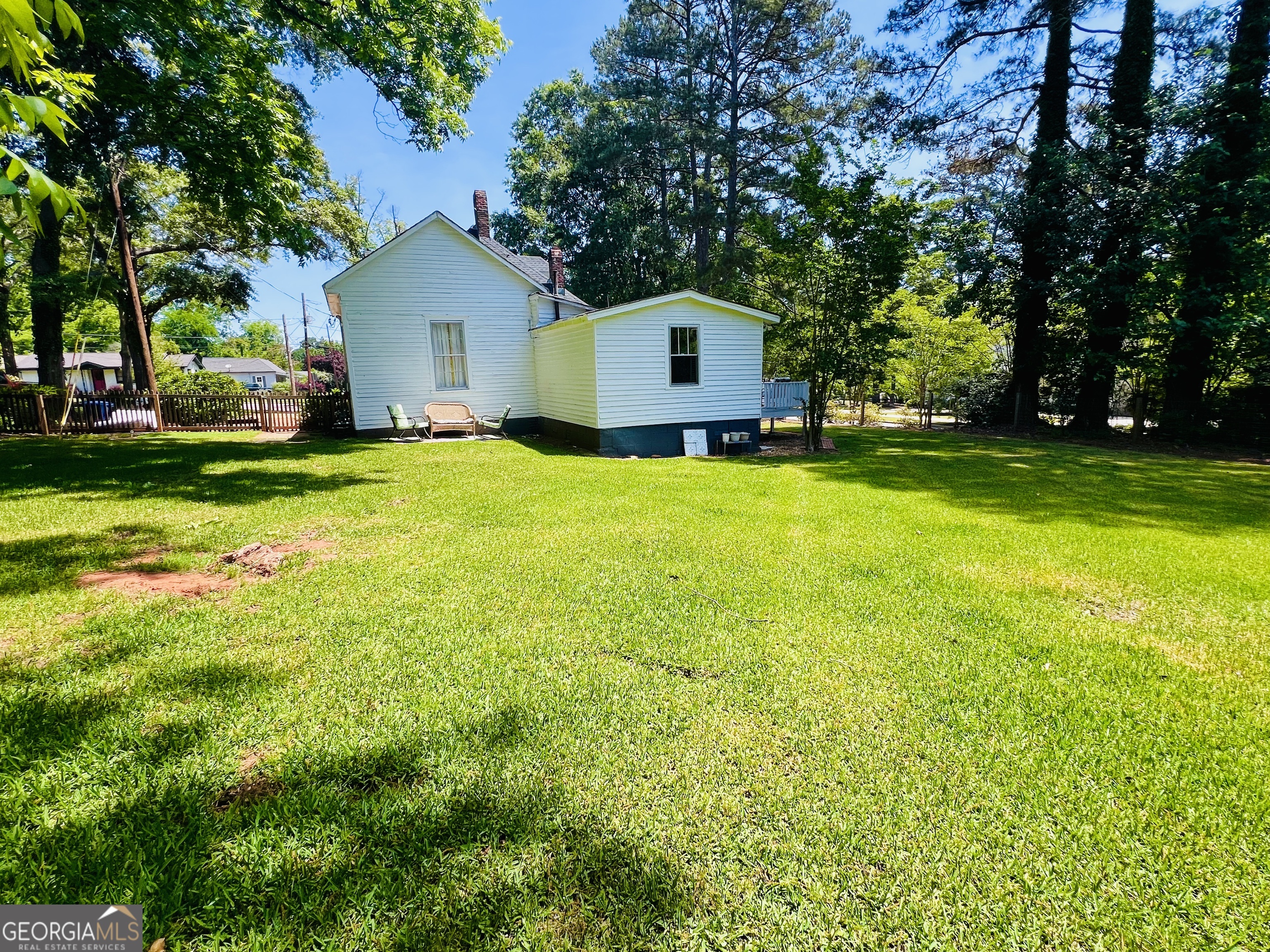600 Foster Street Madison, GA 30650 - Photo 44 of 54 a front view of house with yard and trees