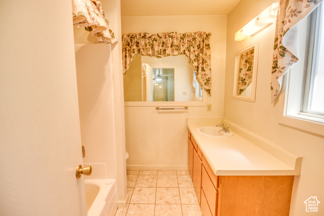 2373 East 190 North Beaver, UT 84713 - Photo 14 of 54 Bathroom featuring light tile patterned floors, vanity, and bathing tub / shower combination