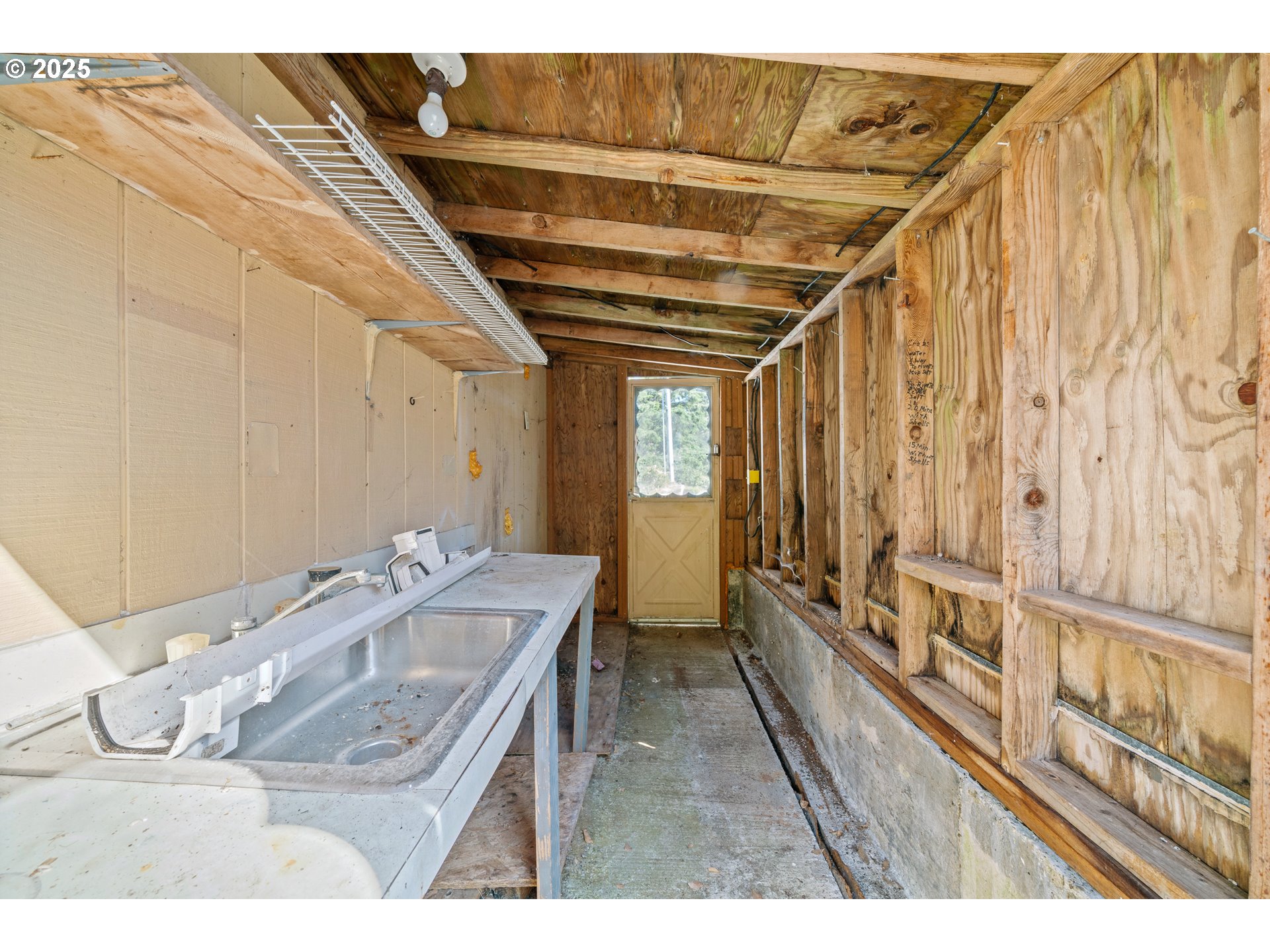 1057 Northeast 12th Avenue Rockaway Beach, OR 97136 - Photo 24 of 36 a bathroom with a sink and mirror