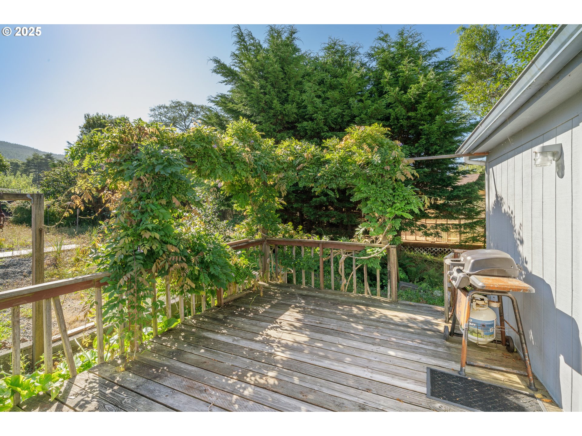 1057 Northeast 12th Avenue Rockaway Beach, OR 97136 - Photo 25 of 36 a view of a chair and tables in the balcony
