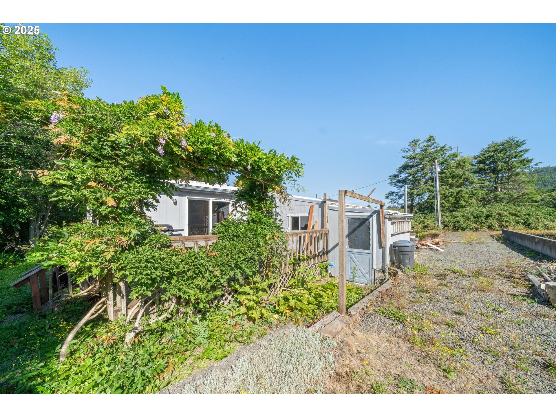 1057 Northeast 12th Avenue Rockaway Beach, OR 97136 - Photo 29 of 36 a view of a house with a yard