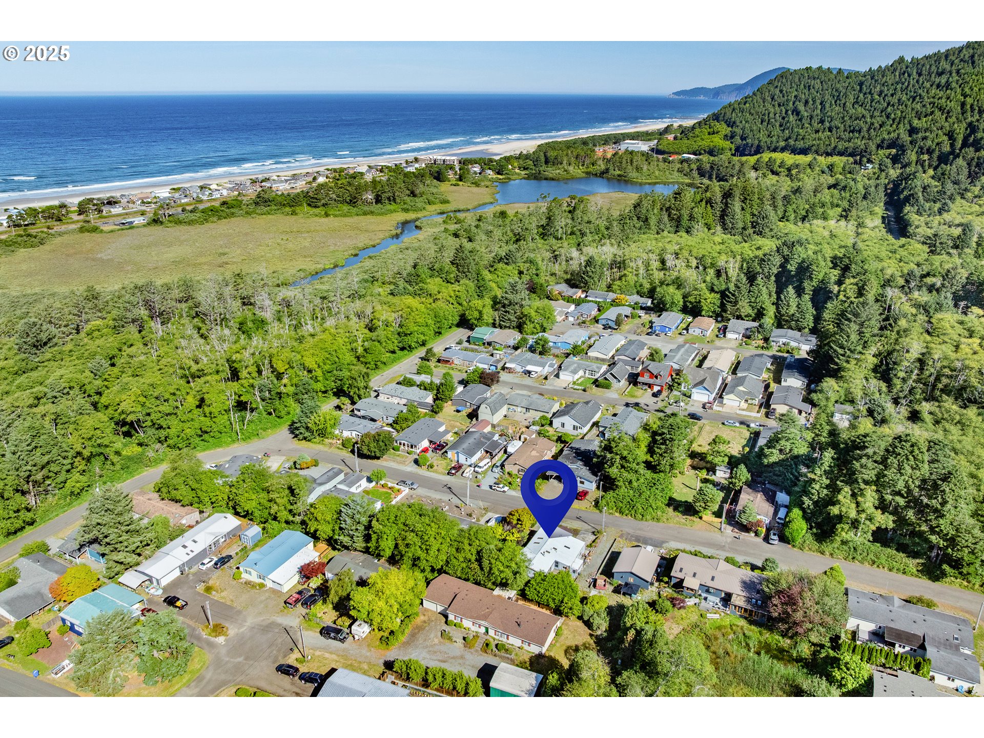 1057 Northeast 12th Avenue Rockaway Beach, OR 97136 - Photo 32 of 36 a view of a lush green space with lots of trees