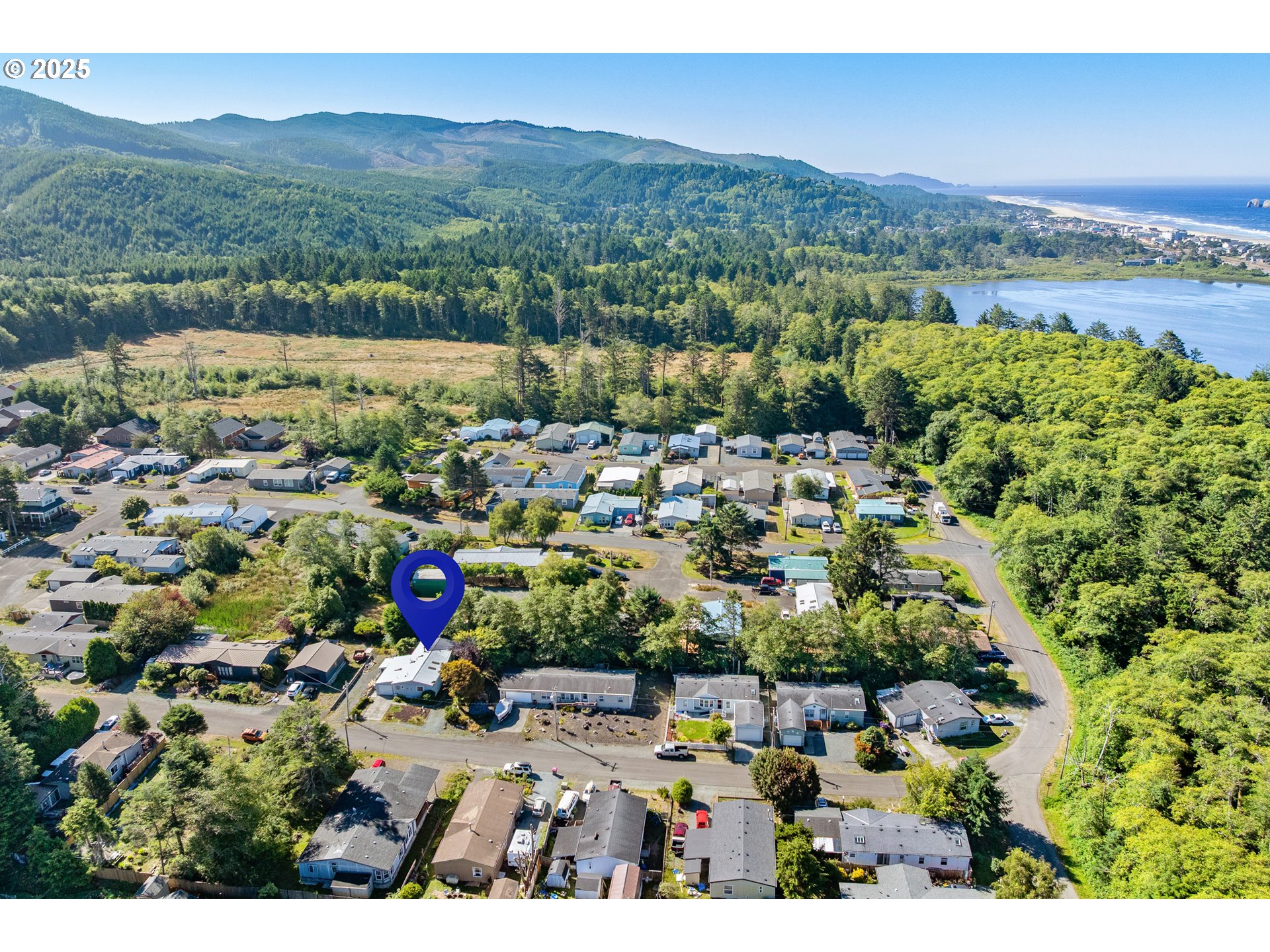 1057 Northeast 12th Avenue Rockaway Beach, OR 97136 - Photo 33 of 36 a view of a city with a mountain