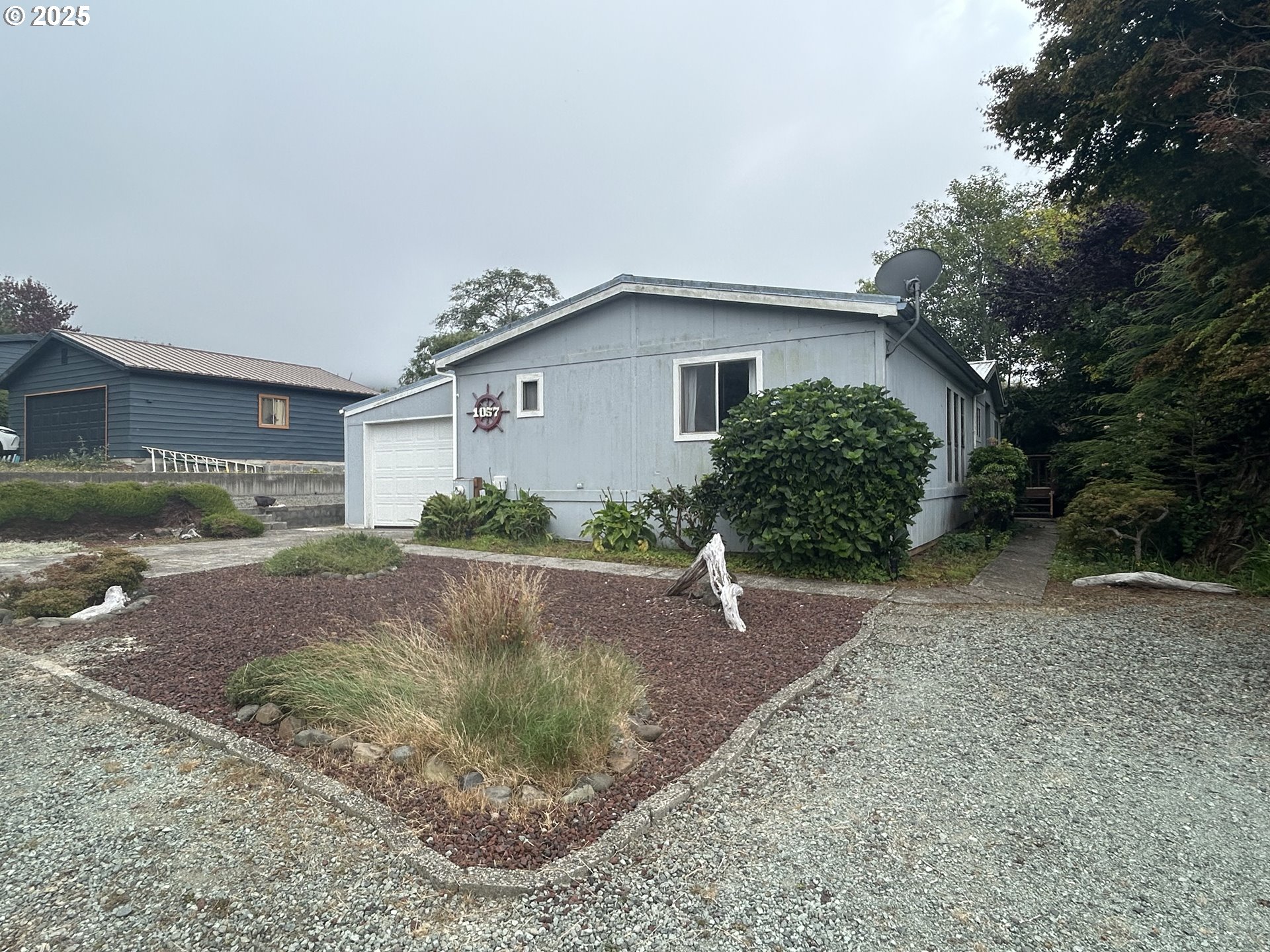 1057 Northeast 12th Avenue Rockaway Beach, OR 97136 - Photo 36 of 36 a view of a house with a yard