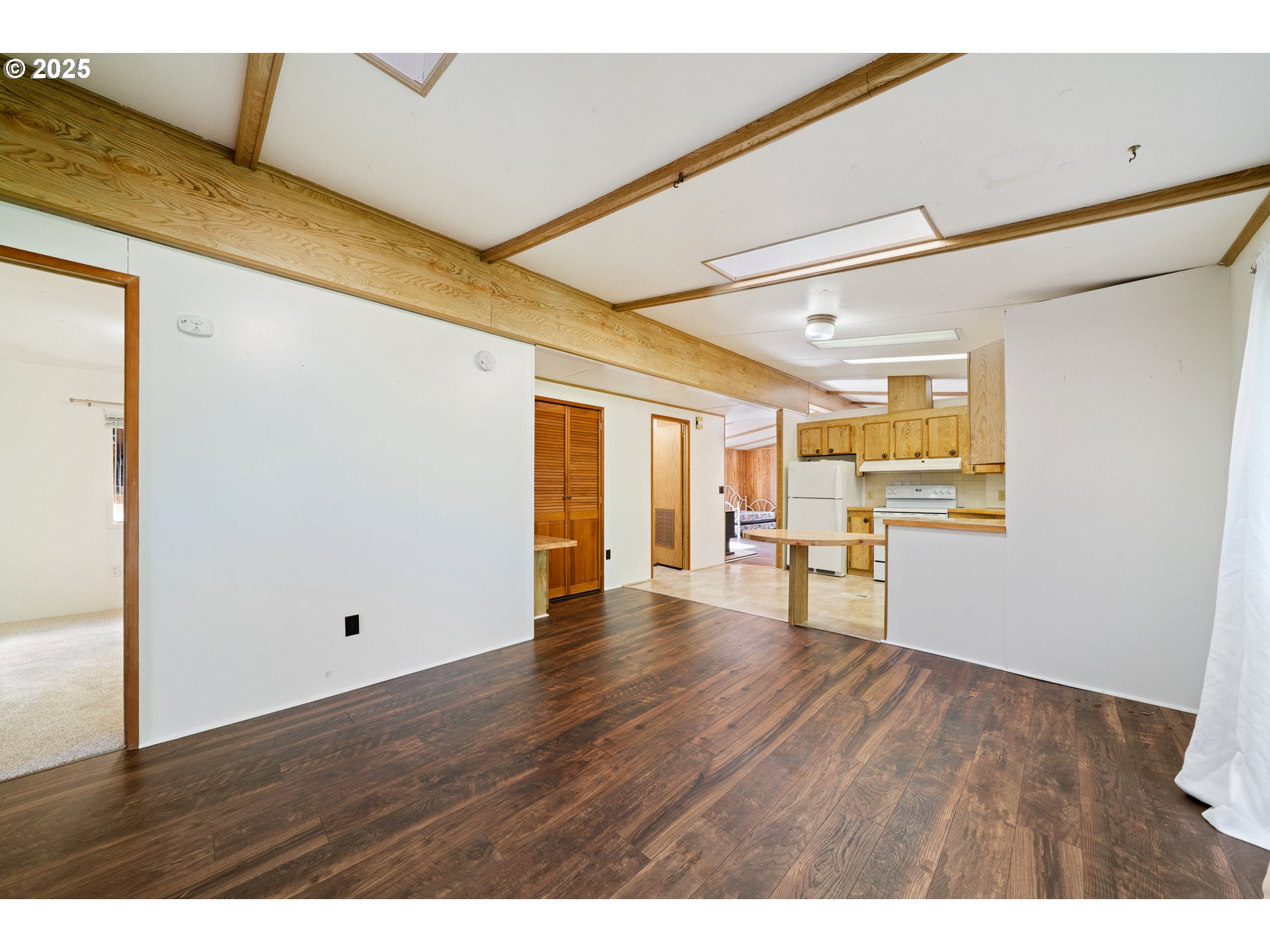 1057 Northeast 12th Avenue Rockaway Beach, OR 97136 - Photo 6 of 36 a view of an empty room with wooden floor