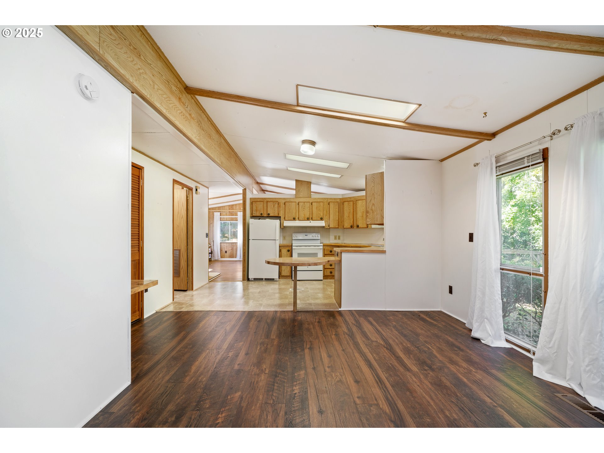 1057 Northeast 12th Avenue Rockaway Beach, OR 97136 - Photo 8 of 36 a view of empty room with wooden floor