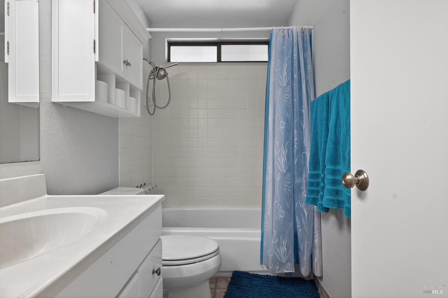 5410 Corbett Circle Santa Rosa, CA 95403 - Photo 27 of 41 a bathroom with a sink a toilet and shower