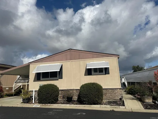 a front view of a house with garage