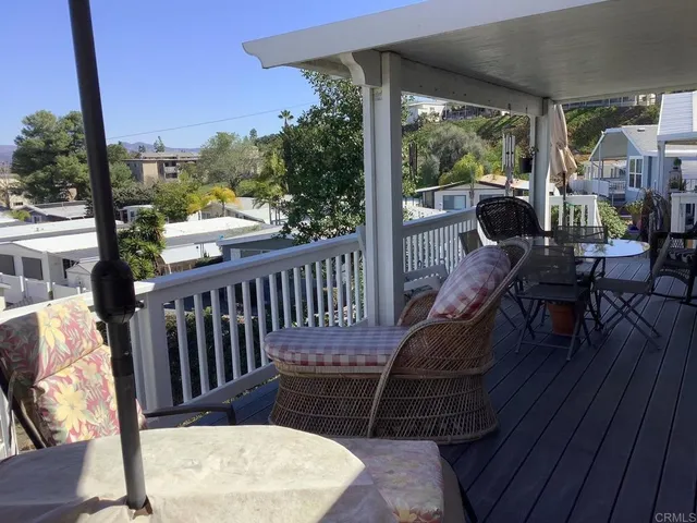 a view of a balcony with furniture