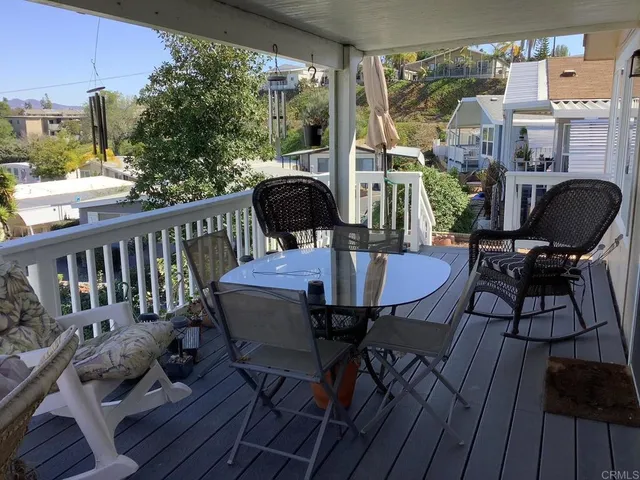 a view of a balcony with furniture