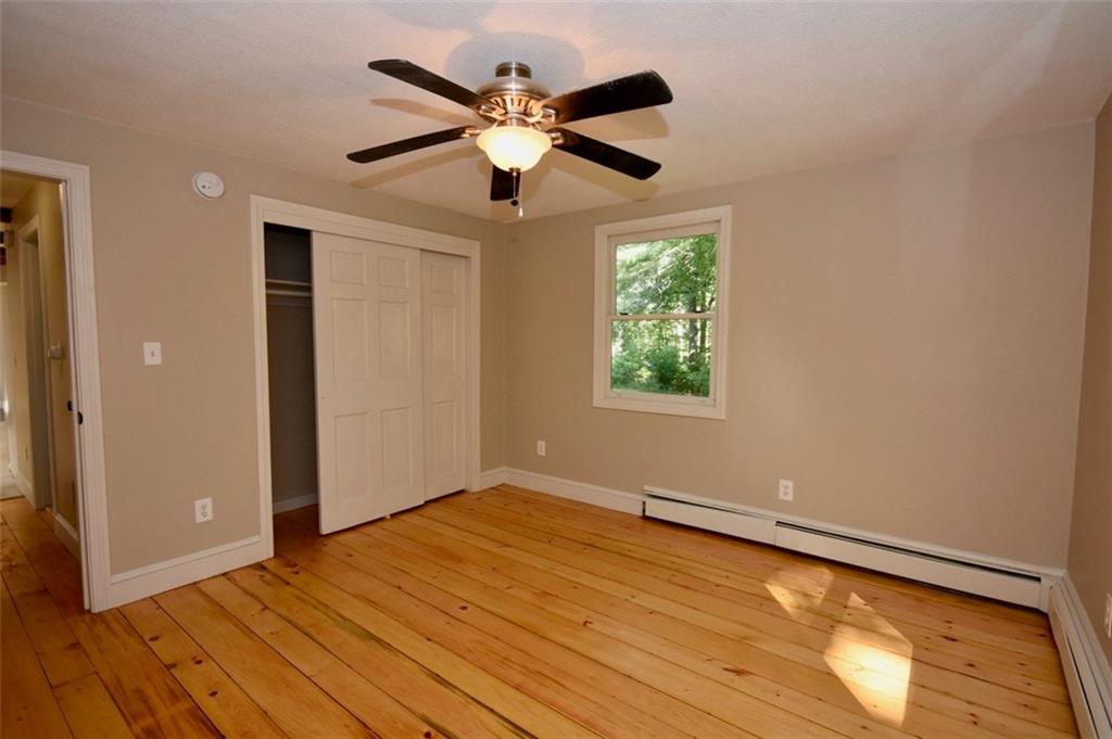 38 Skillin Road Cumberland, ME 04021 - Photo 13 of 17 Rear bedroom with ceiling fan and...