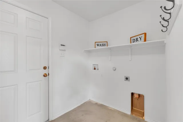 a dining room with furniture potted plants and wooden floor