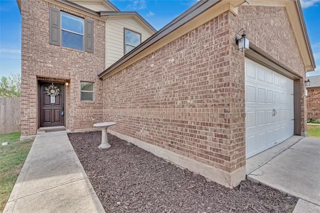 a kitchen with stainless steel appliances granite countertop a kitchen island a stove and a sink
