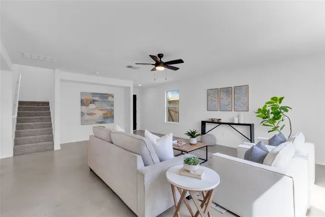a living room with furniture and a window