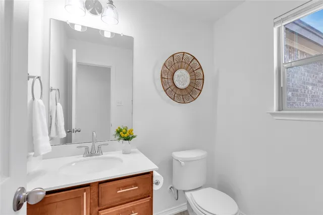 a kitchen with stainless steel appliances granite countertop wooden cabinets a stove top oven a sink and dishwasher