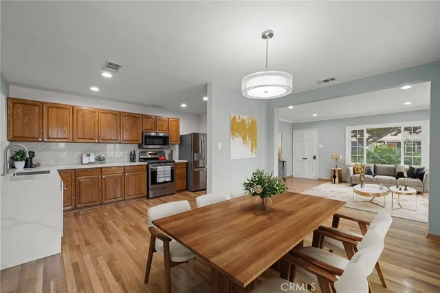 a large kitchen with a table and chairs in it