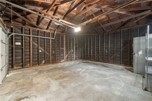 a view of an empty room with wooden walls