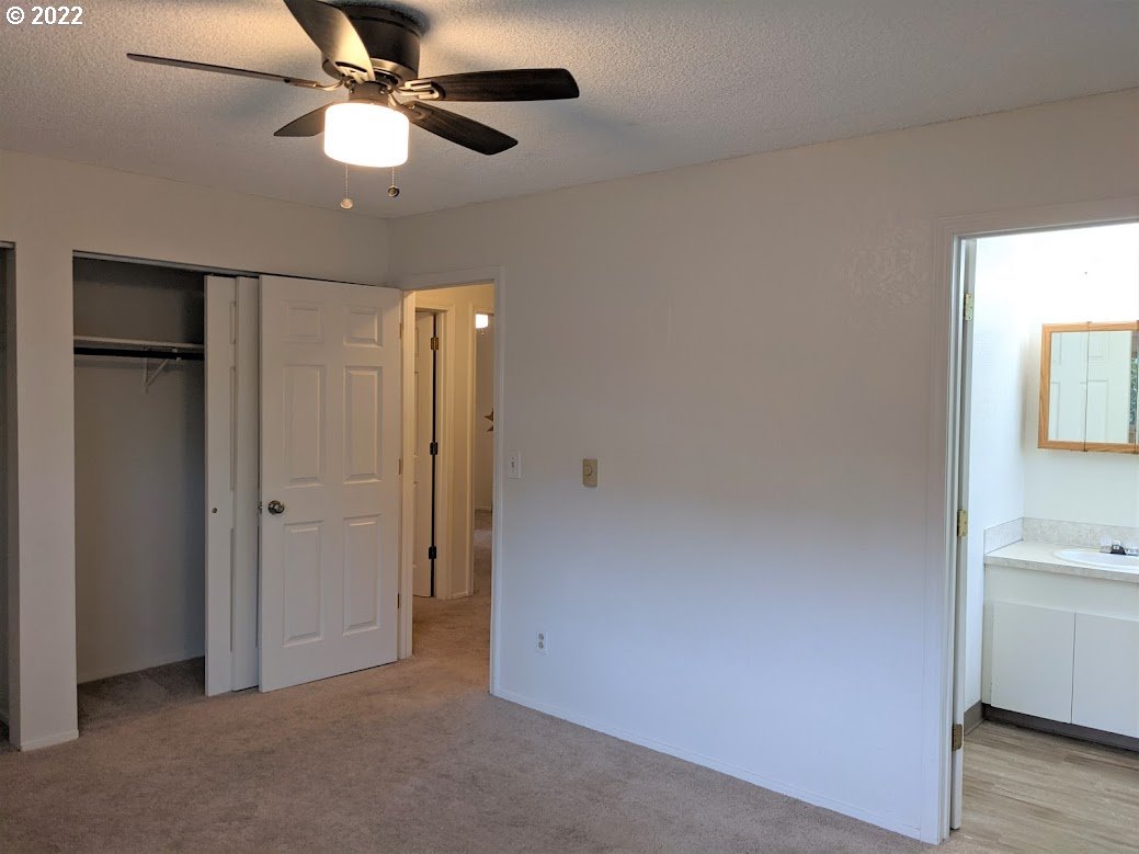 17170 Southwest Merlo Road Beaverton, OR 97003 - Photo 3 of 16 wooden floor in an empty room with a window