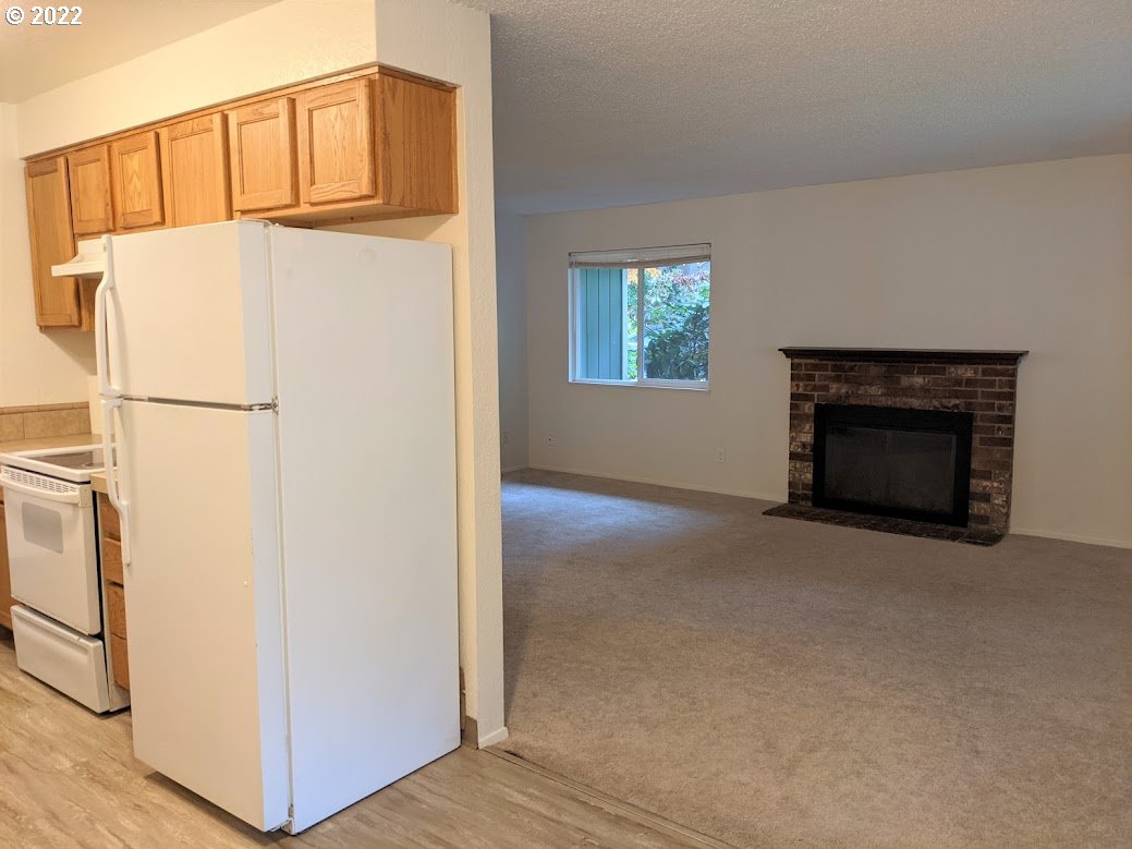 17170 Southwest Merlo Road Beaverton, OR 97003 - Photo 6 of 16 a view of a livingroom with a fireplace