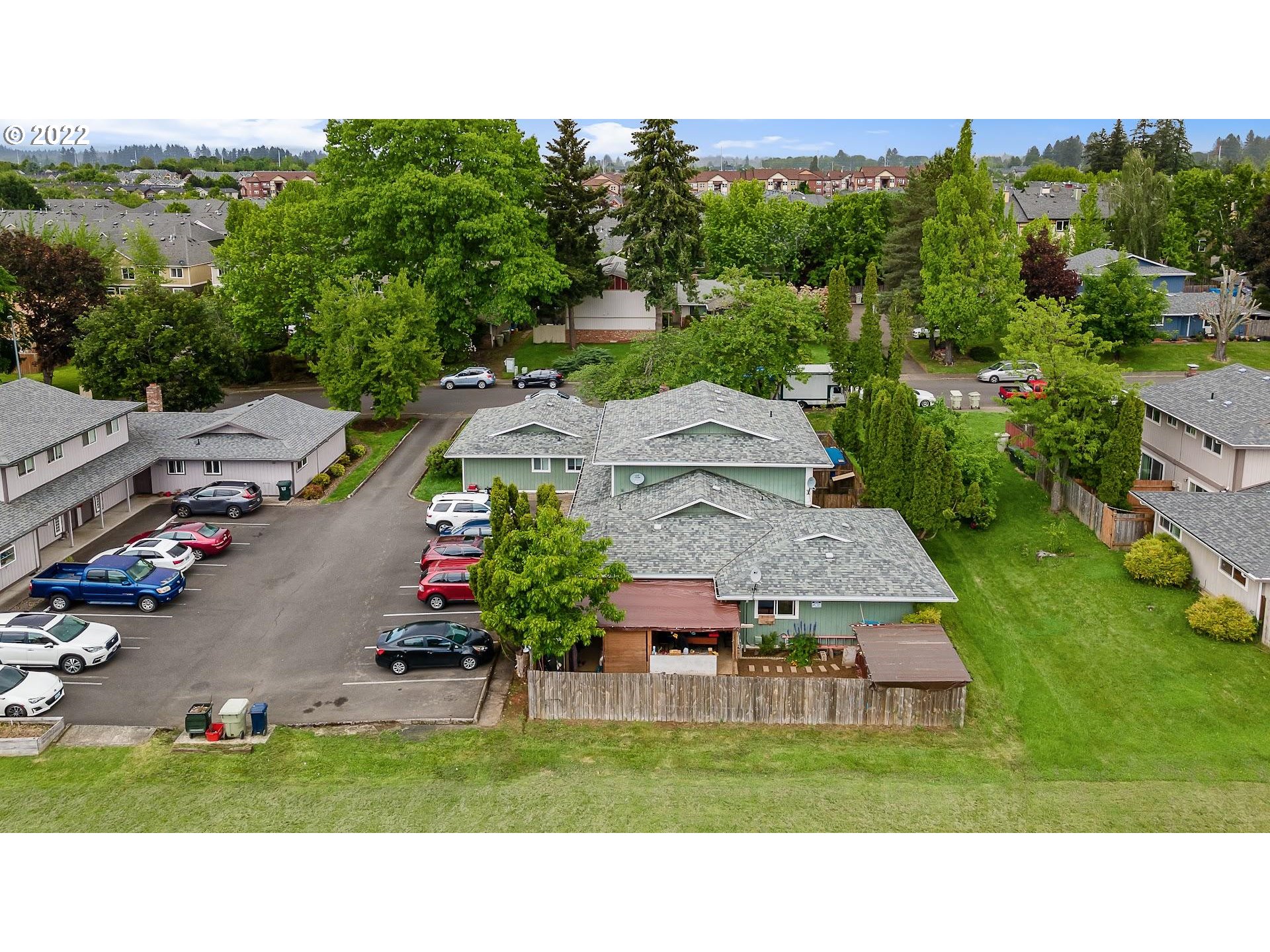 17170 Southwest Merlo Road Beaverton, OR 97003 - Photo 7 of 16 a aerial view of a house with a garden and lake view