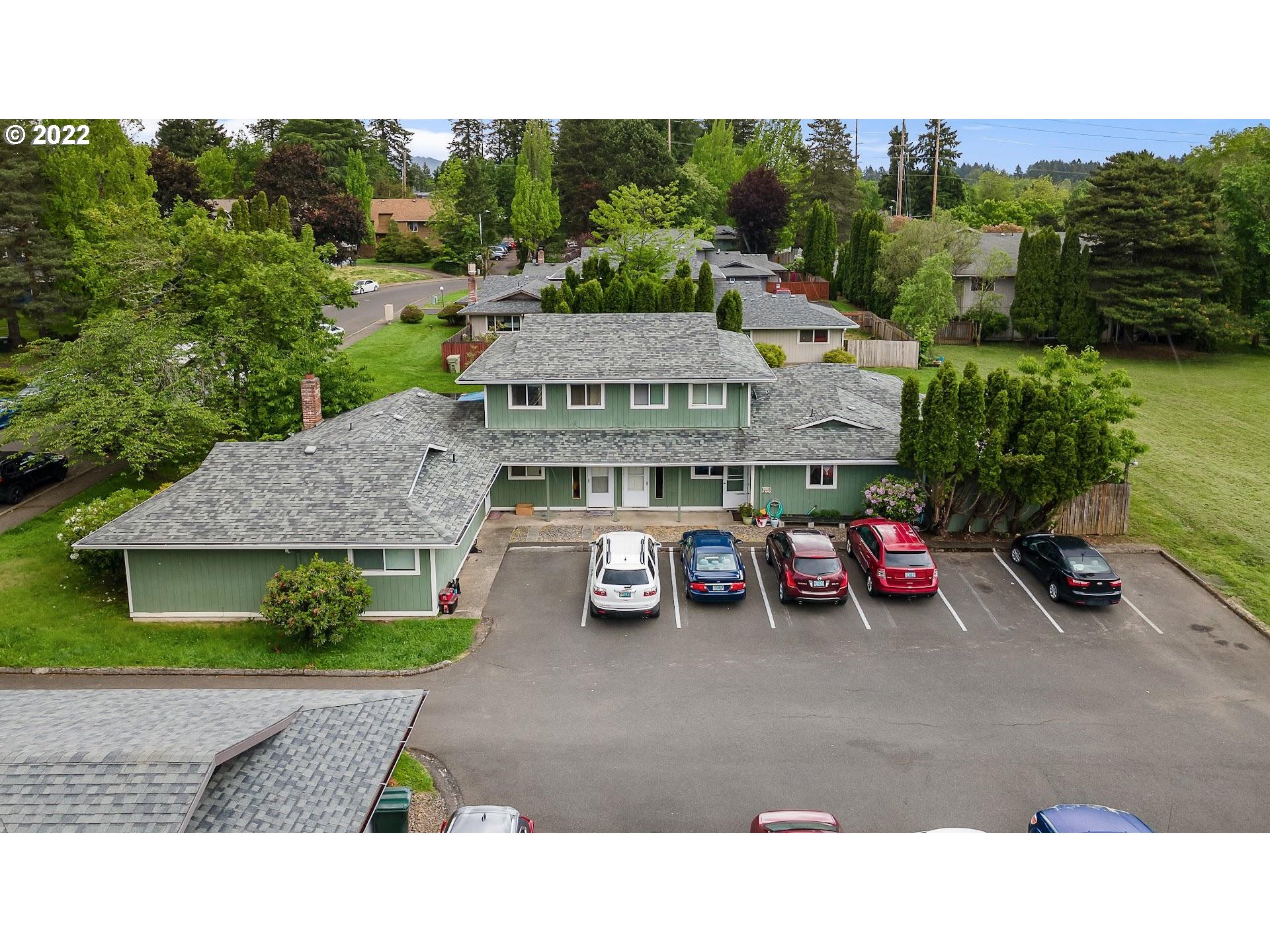 17170 Southwest Merlo Road Beaverton, OR 97003 - Photo 8 of 16 a view of a cars park in front of house