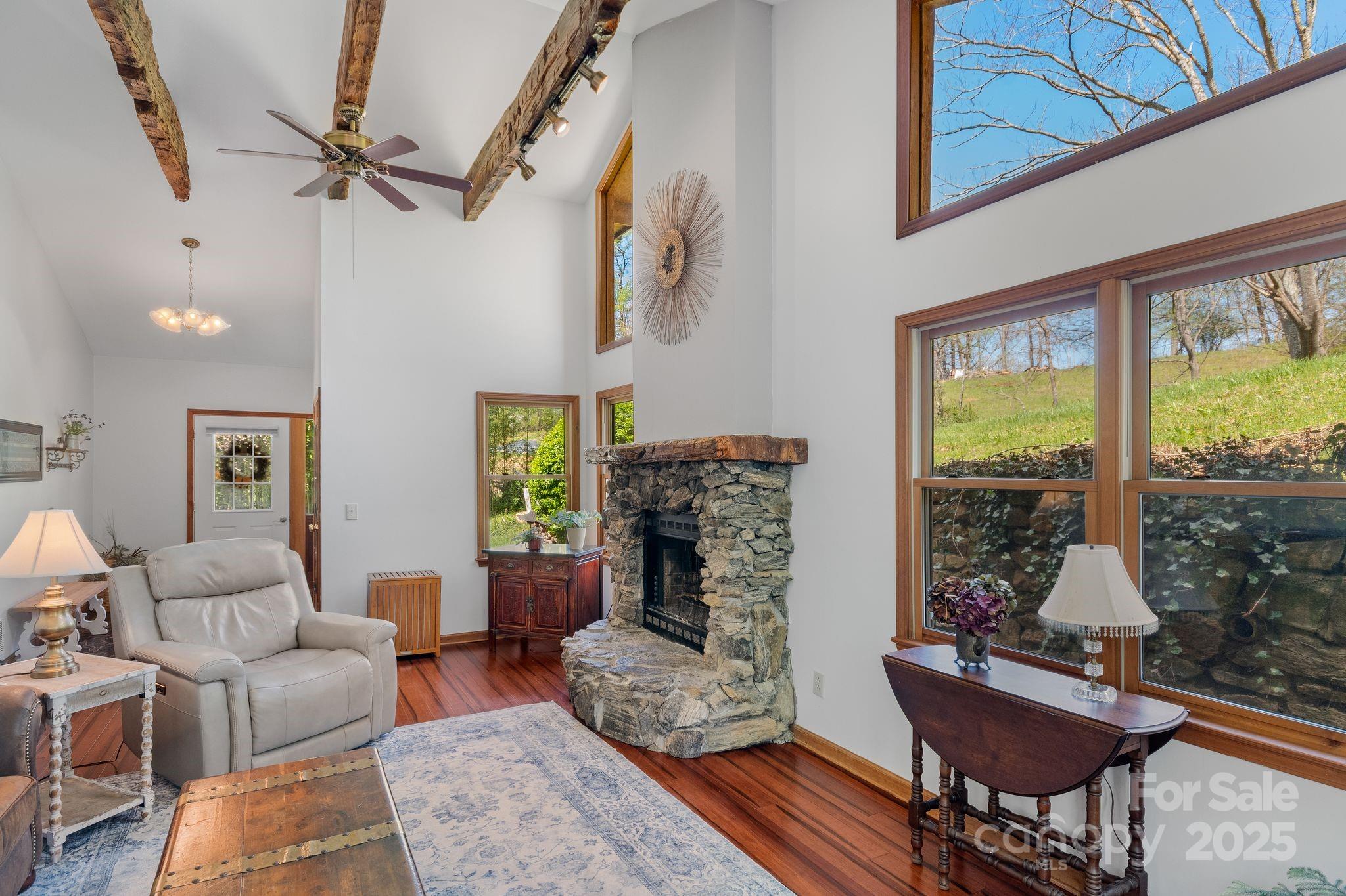22 Morgan Branch Road Weaverville, NC 28787 - Photo 11 of 47 a living room with furniture and a fireplace